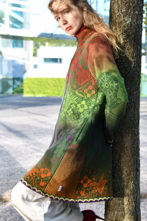 kauni design model wearing a green and brown gradient wool cardigan