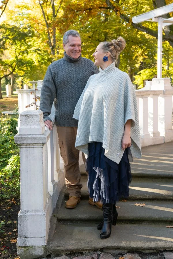 Poncho with fine cable pattern and protective symbol on chest – image 2