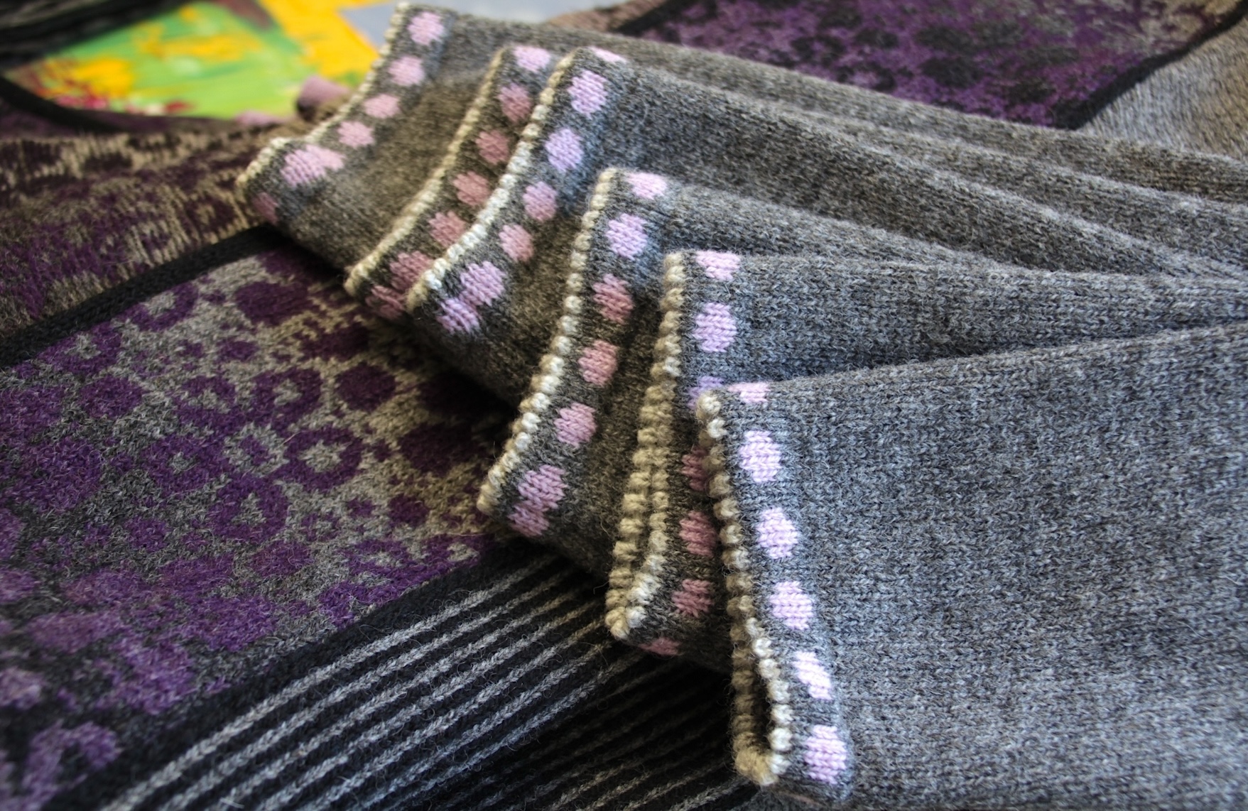 close up details of a wool cardigan with dots