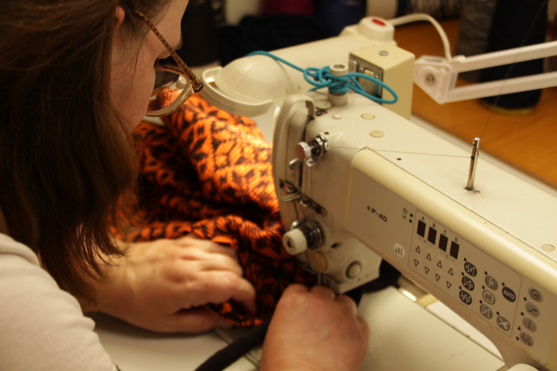 designer kauni sewing lady sewing an estonian pattern wool sweater