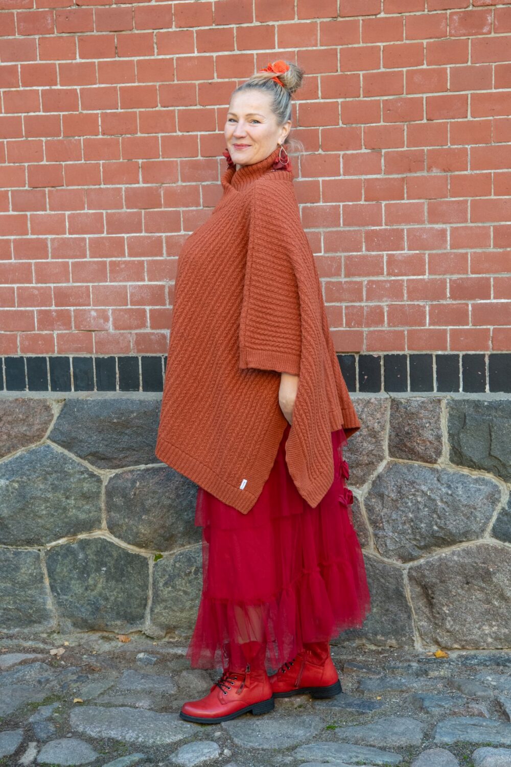 Poncho with fine cable pattern and protective symbol on chest - Image 2