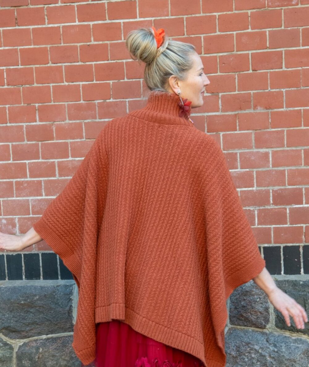 Poncho with fine cable pattern and protective symbol on chest - Image 3
