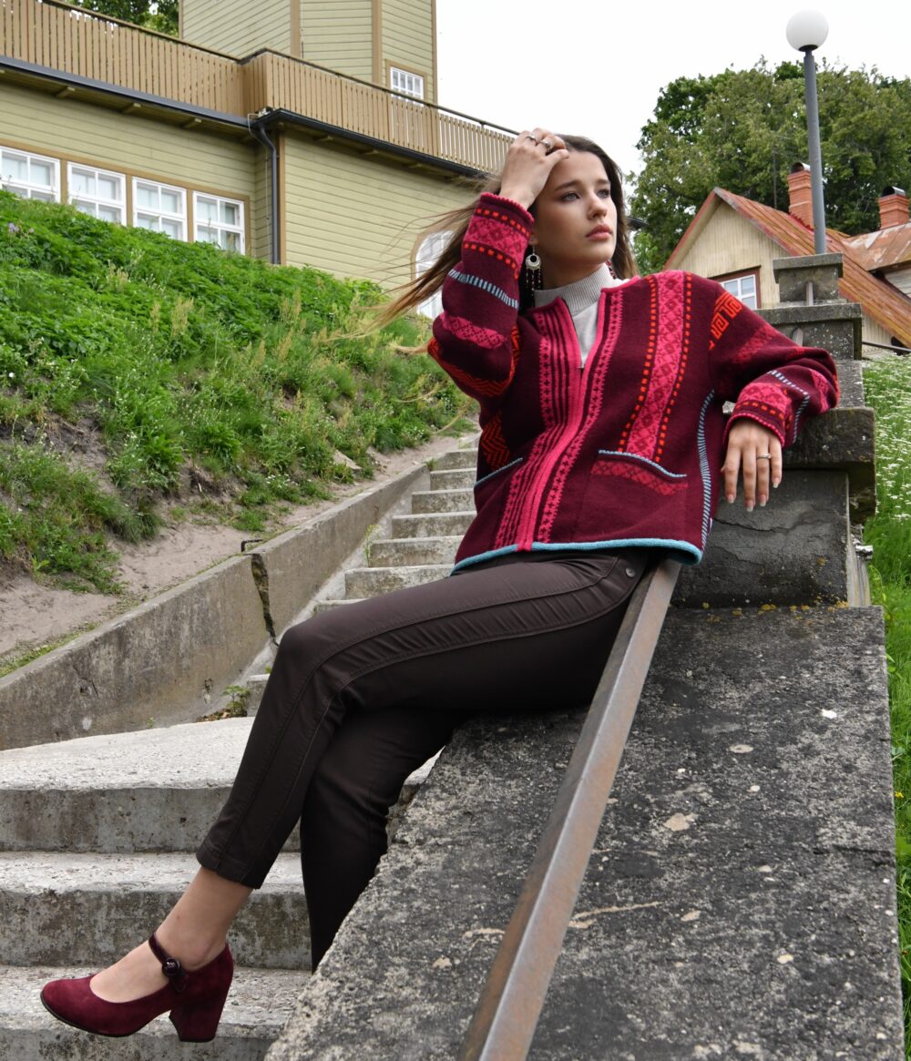 brunette model in short red wool cardigan from kauni design