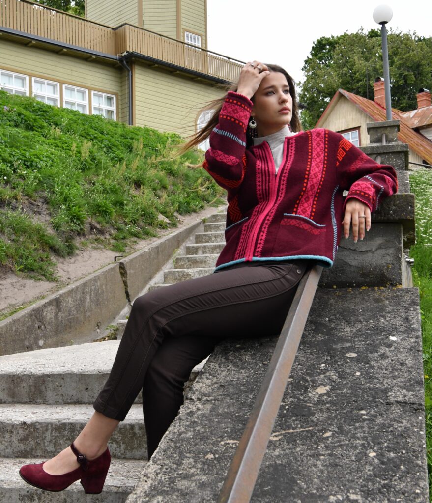 brunette model in short red wool cardigan from kauni design