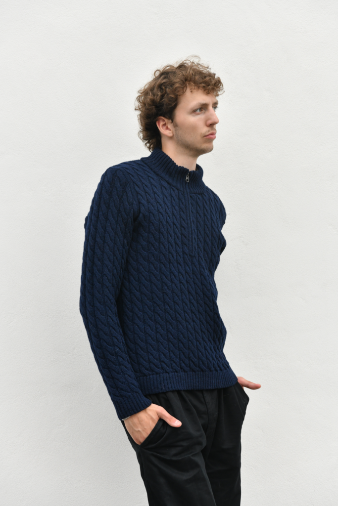man wearing a cable knit quarter-zip pullover from pure wool